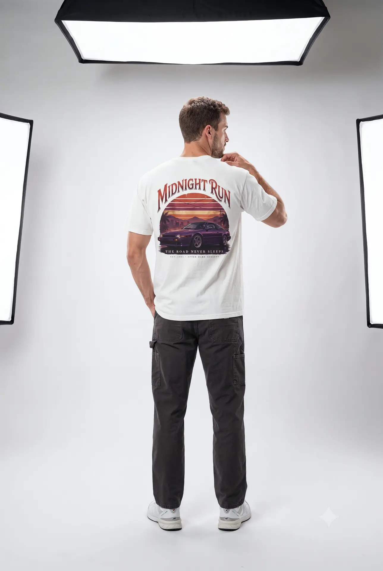 Person wearing a Midnight Run graphic t-shirt featuring a retro-inspired neon cityscape, classic late-night driving artwork, vibrant 90s color palette, and bold vintage typography, photographed in a professional studio.