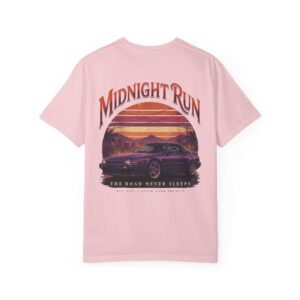 Person wearing a Midnight Run graphic t-shirt featuring a retro-inspired neon cityscape, classic late-night driving artwork, vibrant 90s color palette, and bold vintage typography, photographed in a professional studio.