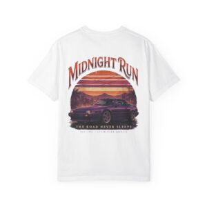 Person wearing a Midnight Run graphic t-shirt featuring a retro-inspired neon cityscape, classic late-night driving artwork, vibrant 90s color palette, and bold vintage typography, photographed in a professional studio.