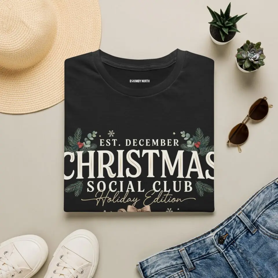 Minimalist Christmas Social Club graphic printed on a unisex Gildan 64000 t-shirt featuring vintage typography, festive holiday foliage, and the "Holiday Edition" tagline.