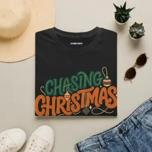 Unisex Gildan 64000 Christmas t-shirt featuring the "Chasing Christmas" vintage typography design with the "Since Snow Fell" tagline in a minimalist holiday streetwear style.