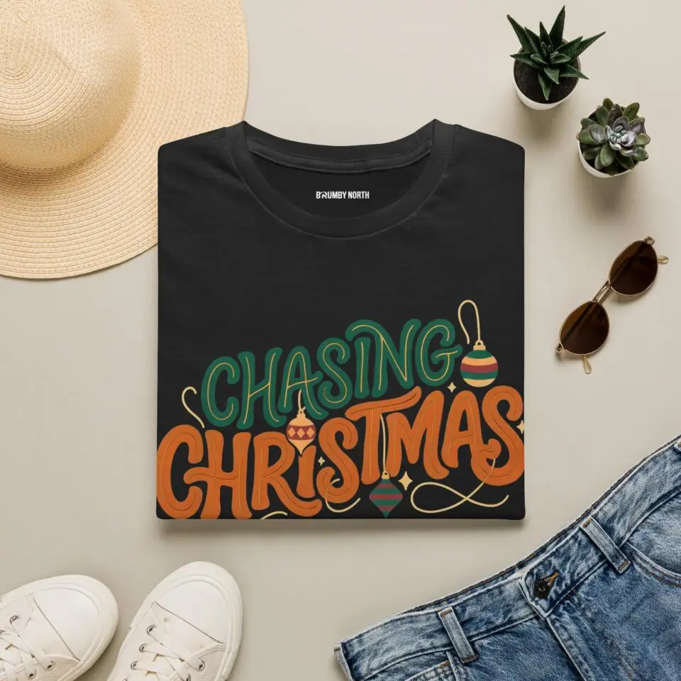 Unisex Gildan 64000 Christmas t-shirt featuring the "Chasing Christmas" vintage typography design with the "Since Snow Fell" tagline in a minimalist holiday streetwear style.