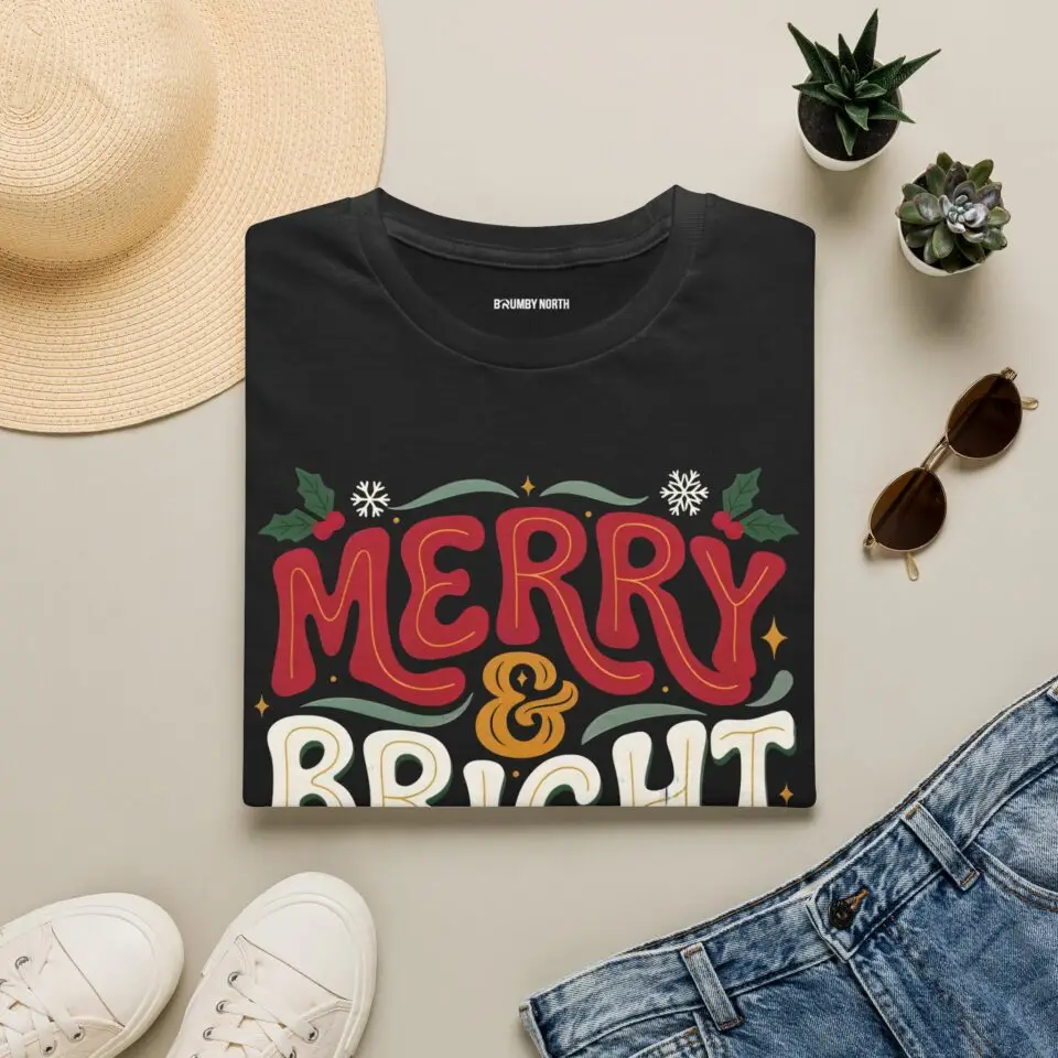 Unisex Gildan 64000 Christmas t-shirt featuring the "Merry & Bright" festive typography design with elegant Christmas leaves in a clean, minimalist holiday style.