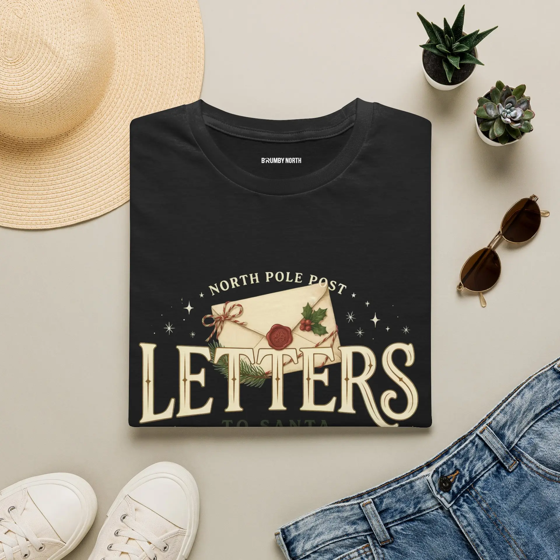 Letters from the North Pole vintage Christmas graphic T-shirt Burgundy Christmas mail graphic tee on female model North Pole Post holiday unisex T-shirt front view Vintage Christmas letter graphic premium cotton shirt