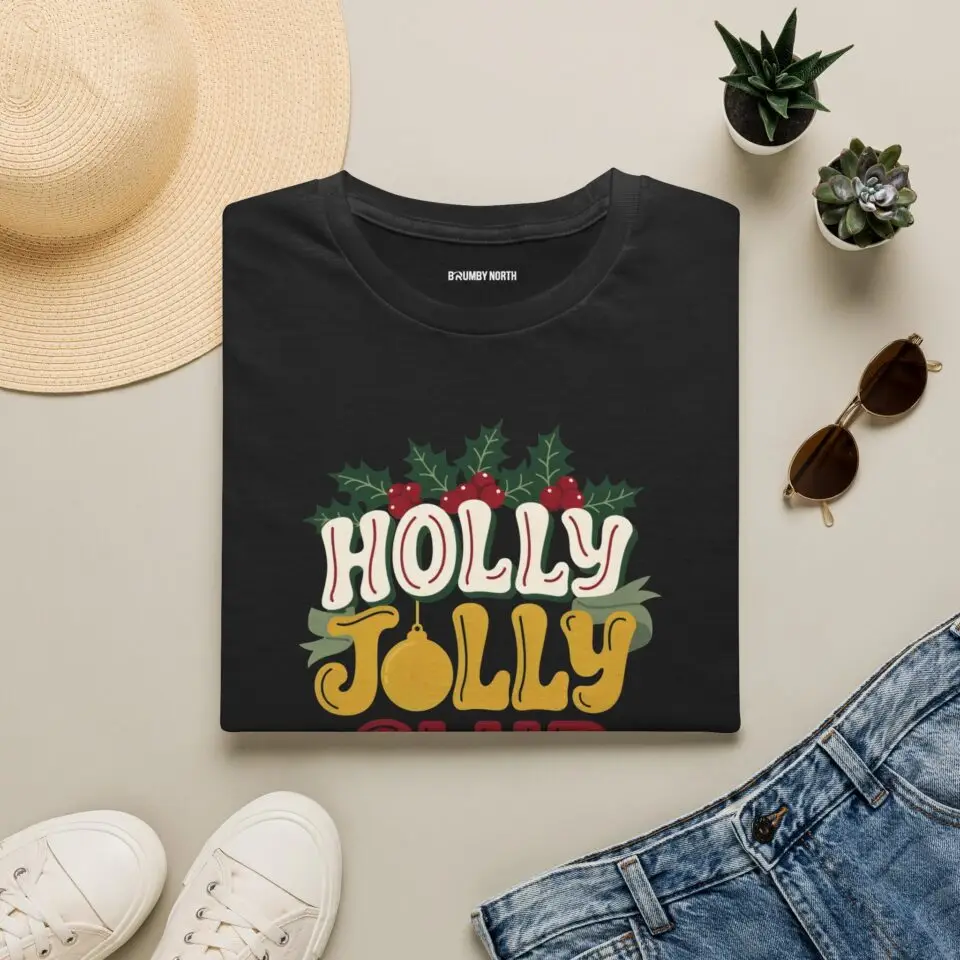 Holly Jolly Club retro Christmas graphic T-shirt on female model Black Holly Jolly Club holiday graphic tee front view Vintage Christmas typography unisex T-shirt Retro festive Christmas shirt with holly leaf design