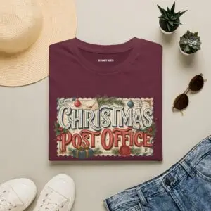 Christmas Post Office vintage holiday graphic T-shirt on female model Black Christmas Post Office retro postal graphic tee front view Vintage Christmas mail themed unisex T-shirt Christmas Post Office holiday graphic shirt with antique postal artwork