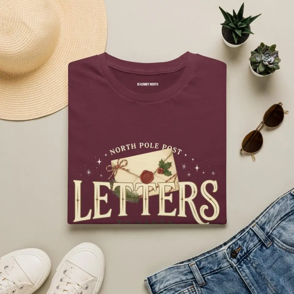 Letters from the North Pole vintage Christmas graphic T-shirt Burgundy Christmas mail graphic tee on female model North Pole Post holiday unisex T-shirt front view Vintage Christmas letter graphic premium cotton shirt