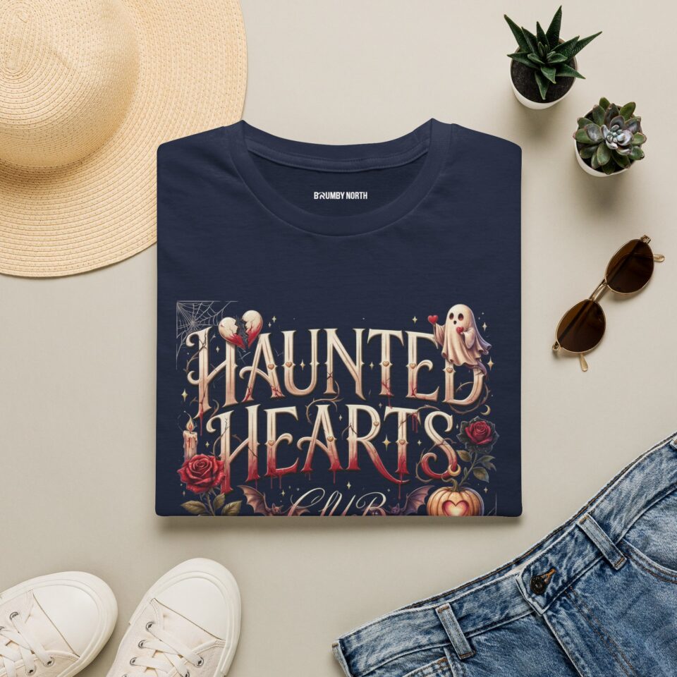 Woman wearing a black Haunted Hearts Club gothic Halloween graphic t-shirt featuring vintage pumpkins, ghosts, and floral artwork.