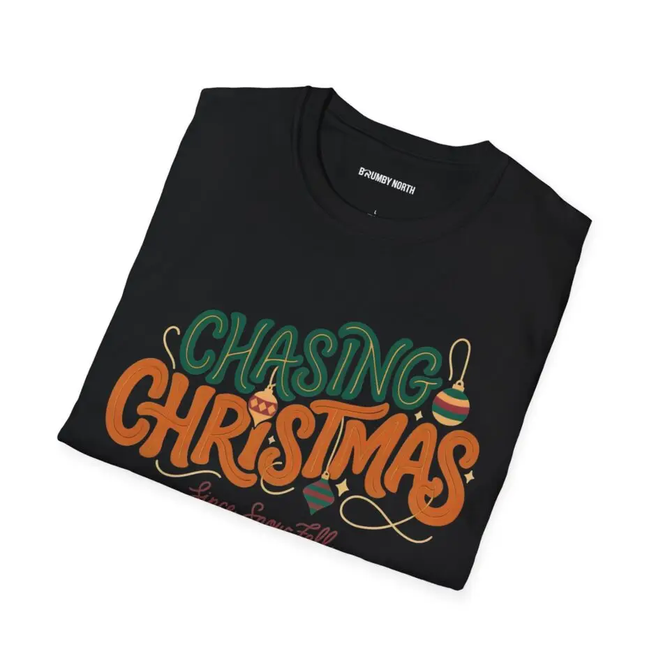 Unisex Gildan 64000 Christmas t-shirt featuring the "Chasing Christmas" vintage typography design with the "Since Snow Fell" tagline in a minimalist holiday streetwear style.