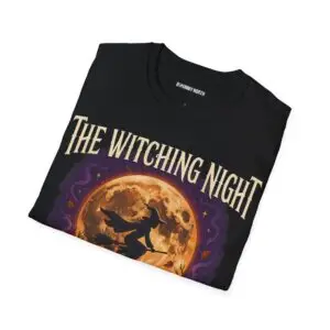 Front view of a black Gildan Softstyle 64000 unisex t-shirt featuring "The Witching Night" vintage Halloween graphic with a full moon, flying witch, and gothic typography, modeled in a studio setting.
