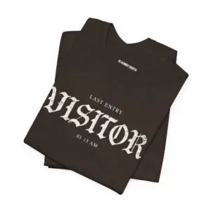 Image Alt Text (Front) Black Bella+Canvas 3001 unisex t-shirt featuring a vintage gothic "Visitor" front graphic with minimalist horror typography, modeled in a studio setting. Image Alt Text (Back) Back view of a black Bella+Canvas 3001 unisex t-shirt featuring "The Last Visitor" gothic horror back graphic with vintage typography and subtle distressed details, modeled in a studio setting.
