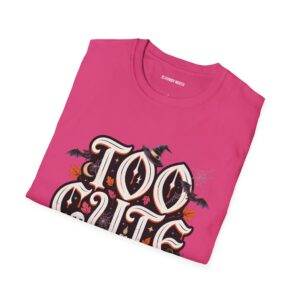 Woman wearing a black Too Cute To Haunt Halloween graphic t-shirt featuring vintage typography, a cute ghost, pumpkin, autumn leaves, and spooky accents in a professional studio.