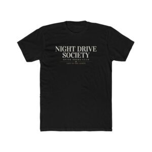 Person wearing a Night Drive Society graphic t-shirt featuring a retro-futuristic neon city skyline, rain-soaked streets, towering palm trees, and a classic car driving into the night with bold typography reading "No Destination Required" and "Lost In The Lights • Built For The After Hours," photographed in a professional studio.