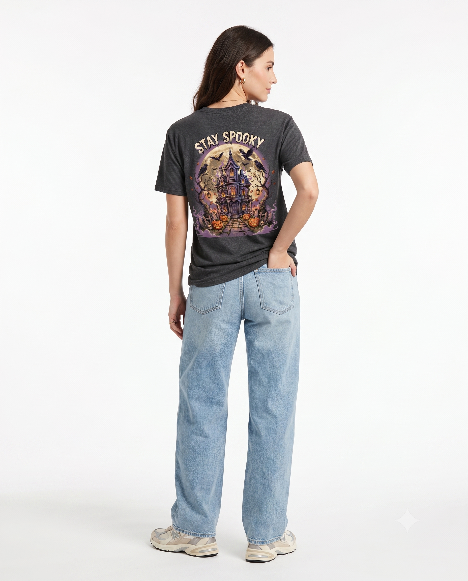 Back view of a black Stay Spooky unisex heavy cotton t-shirt featuring a large vintage Halloween graphic and bold retro typography.