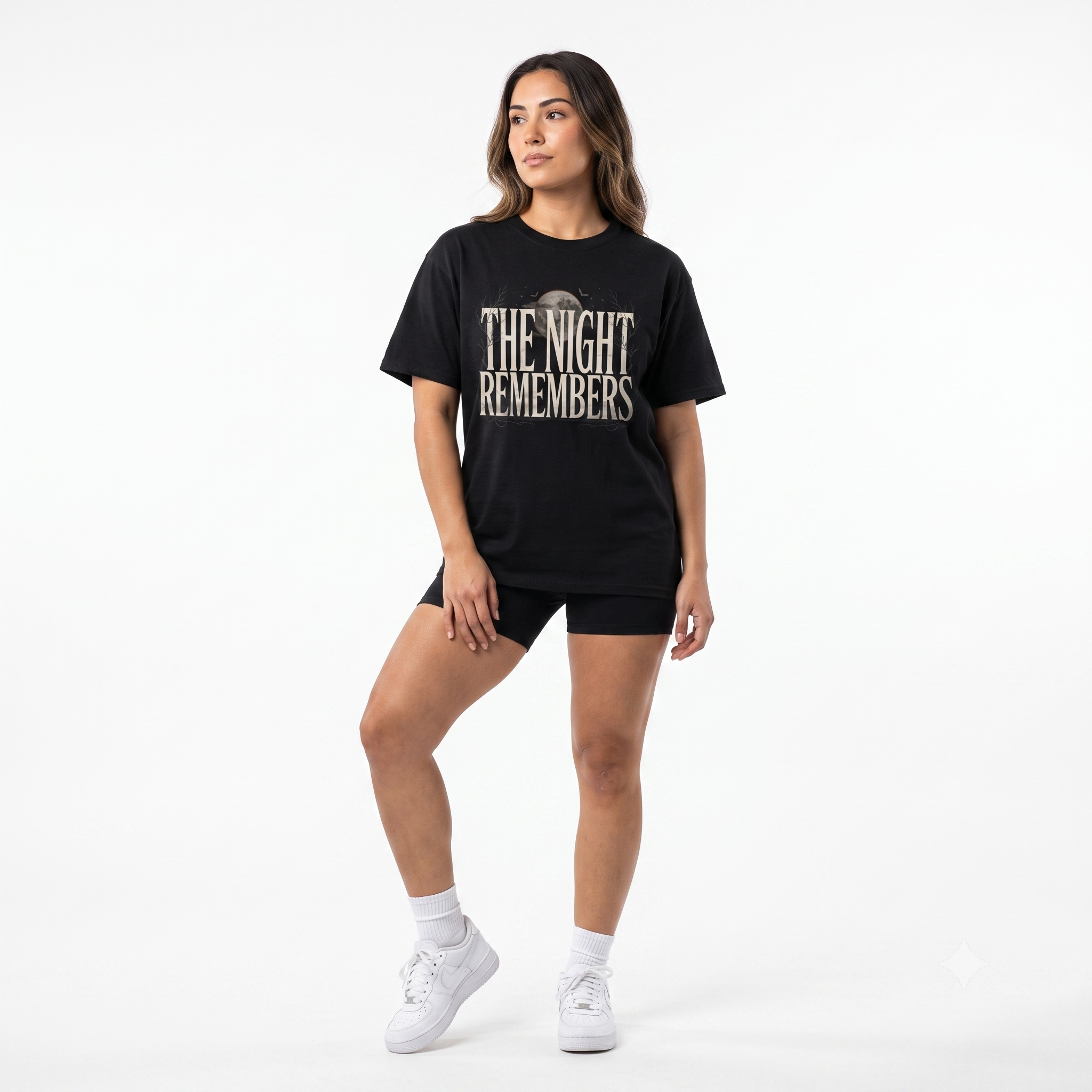 Front Mockup 1 The Night Remembers gothic moon graphic t-shirt featuring vintage typography, full moon, bats and haunted tree artwork. Front Mockup 2 Women's gothic Halloween graphic tee with The Night Remembers vintage moon design. Front Mockup 3 Vintage Halloween t-shirt with bold gothic typography and spooky moon artwork. Front Mockup 4 Dark aesthetic graphic t-shirt featuring The Night Remembers moon and haunted forest illustration. Back Mockup 1 Back view of The Night Remembers gothic Halloween t-shirt showing premium unisex fit. Back Mockup 2 Rear view of premium Gildan 64000 Halloween graphic tee from Brumbynorth. Close-up 1 Close-up of premium DTG printed gothic moon artwork on soft ring-spun cotton fabric. Close-up 2 Detailed close-up of The Night Remembers Halloween graphic showing crisp vintage typography and moon illustration.