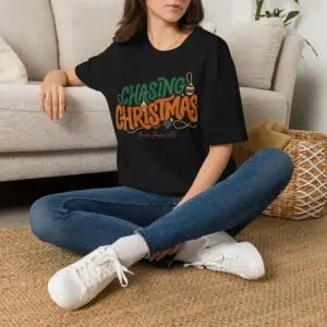 Unisex Gildan 64000 Christmas t-shirt featuring the "Chasing Christmas" vintage typography design with the "Since Snow Fell" tagline in a minimalist holiday streetwear style.