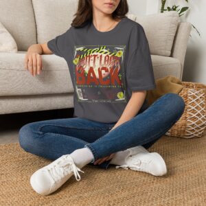Woman wearing a navy blue Watch Your Back vintage Halloween graphic unisex t-shirt with distressed typography and spooky artwork on a white studio background.