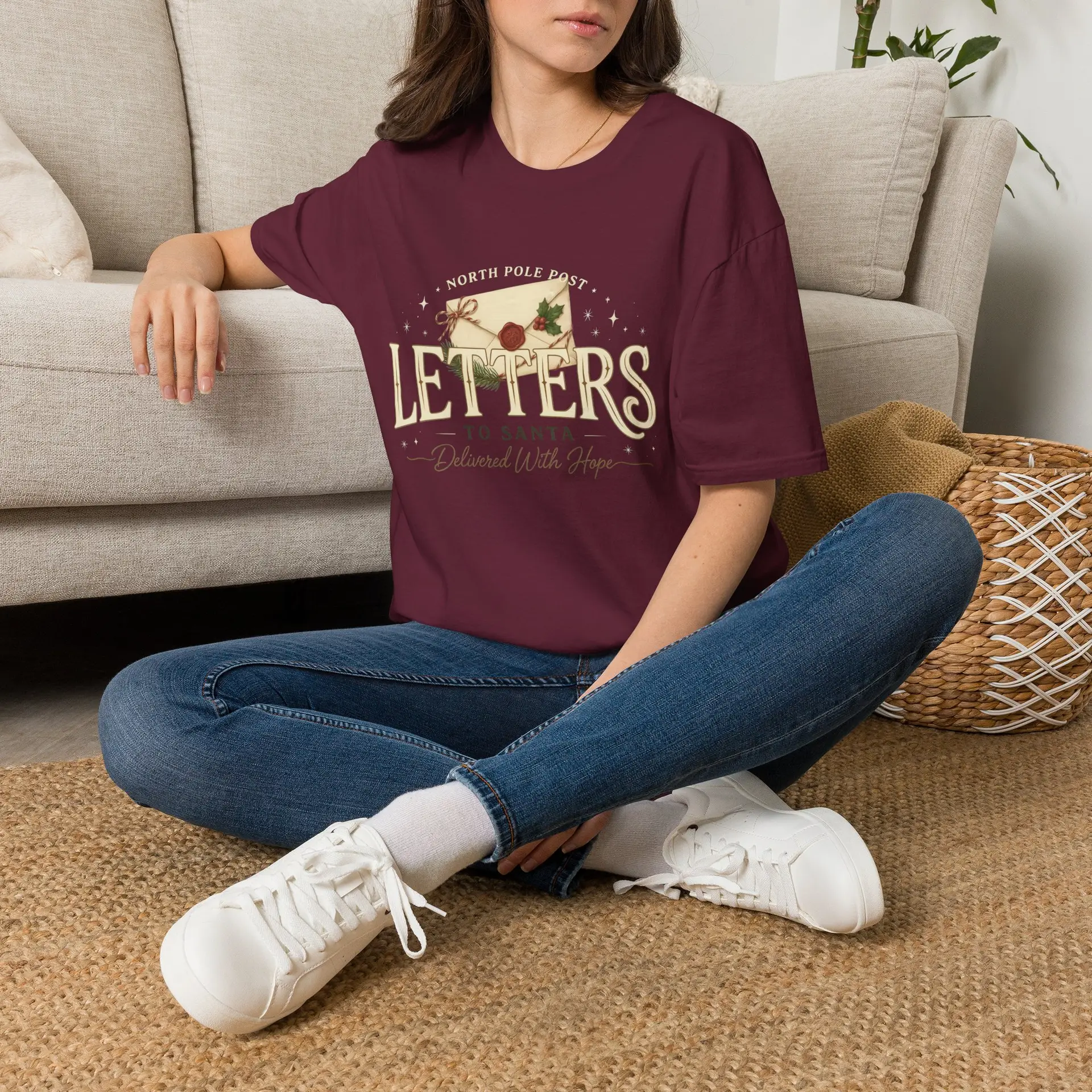 Letters from the North Pole vintage Christmas graphic T-shirt Burgundy Christmas mail graphic tee on female model North Pole Post holiday unisex T-shirt front view Vintage Christmas letter graphic premium cotton shirt