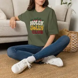 Holly Jolly Club retro Christmas graphic T-shirt on female model Black Holly Jolly Club holiday graphic tee front view Vintage Christmas typography unisex T-shirt Retro festive Christmas shirt with holly leaf design