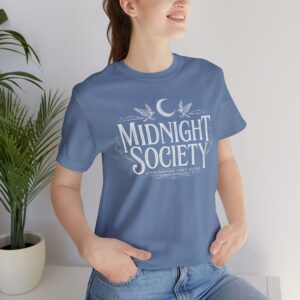 Woman wearing Midnight Society Gothic Halloween graphic t-shirt featuring vintage moon and bat front design. Bella+Canvas Midnight Society Halloween t-shirt with gothic front print on premium unisex cotton tee. Front view of Midnight Society spooky season graphic tee with moon, bats and vintage gothic typography. Premium Halloween graphic t-shirt with minimalist Midnight Society front artwork for autumn fashion