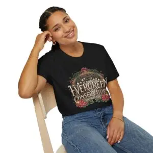 Evergreen Conservatory vintage botanical Christmas graphic T-shirt on female model Navy Evergreen Conservatory holiday greenhouse graphic tee front view Vintage botanical Christmas unisex T-shirt Evergreen Conservatory festive greenhouse graphic shirt