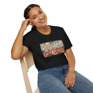 Christmas Post Office vintage holiday graphic T-shirt on female model Black Christmas Post Office retro postal graphic tee front view Vintage Christmas mail themed unisex T-shirt Christmas Post Office holiday graphic shirt with antique postal artwork