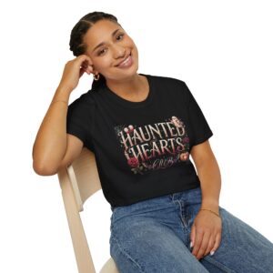 Woman wearing a black Haunted Hearts Club gothic Halloween graphic t-shirt featuring vintage pumpkins, ghosts, and floral artwork.