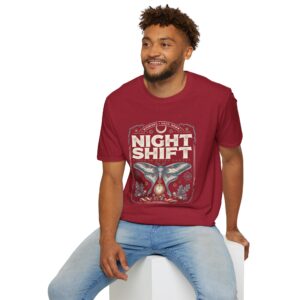 Woman wearing a red Night Shift vintage moth graphic unisex t-shirt with gothic typography and pocket watch illustration on a white studio background.