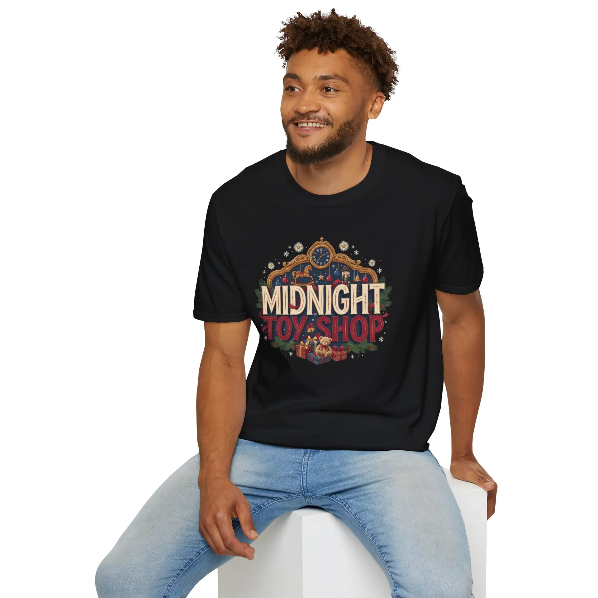 Woman wearing a black Midnight Toy Shop vintage Christmas graphic unisex t-shirt featuring retro holiday typography and festive toy store artwork while wearing a Santa hat in a white studio setting.