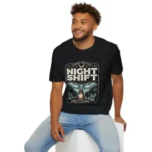 Woman wearing a red Night Shift vintage moth graphic unisex t-shirt with gothic typography and pocket watch illustration on a white studio background.