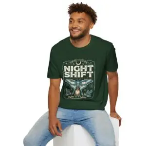 Woman wearing a red Night Shift vintage moth graphic unisex t-shirt with gothic typography and pocket watch illustration on a white studio background.