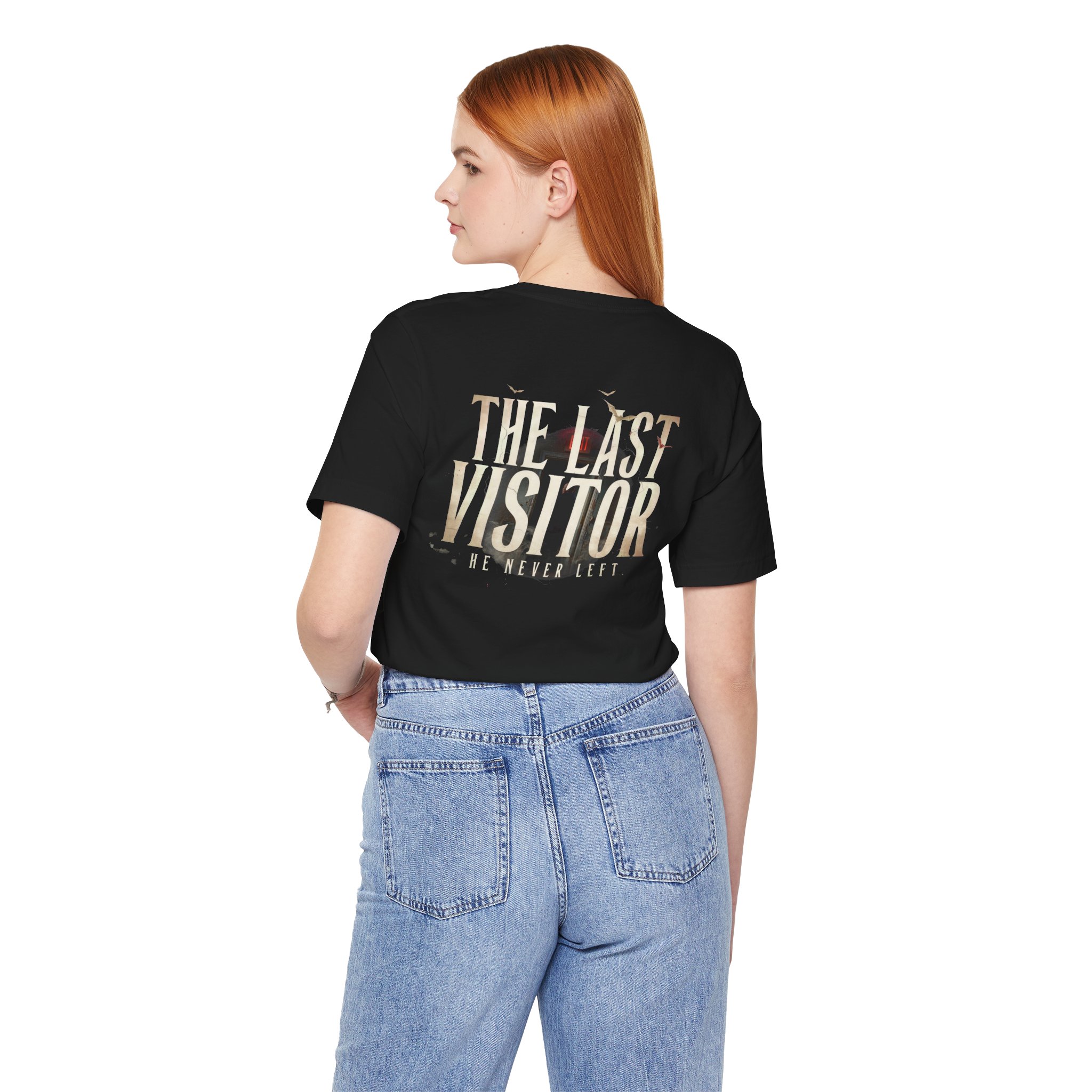 Image Alt Text (Front) Black Bella+Canvas 3001 unisex t-shirt featuring a vintage gothic "Visitor" front graphic with minimalist horror typography, modeled in a studio setting. Image Alt Text (Back) Back view of a black Bella+Canvas 3001 unisex t-shirt featuring "The Last Visitor" gothic horror back graphic with vintage typography and subtle distressed details, modeled in a studio setting.