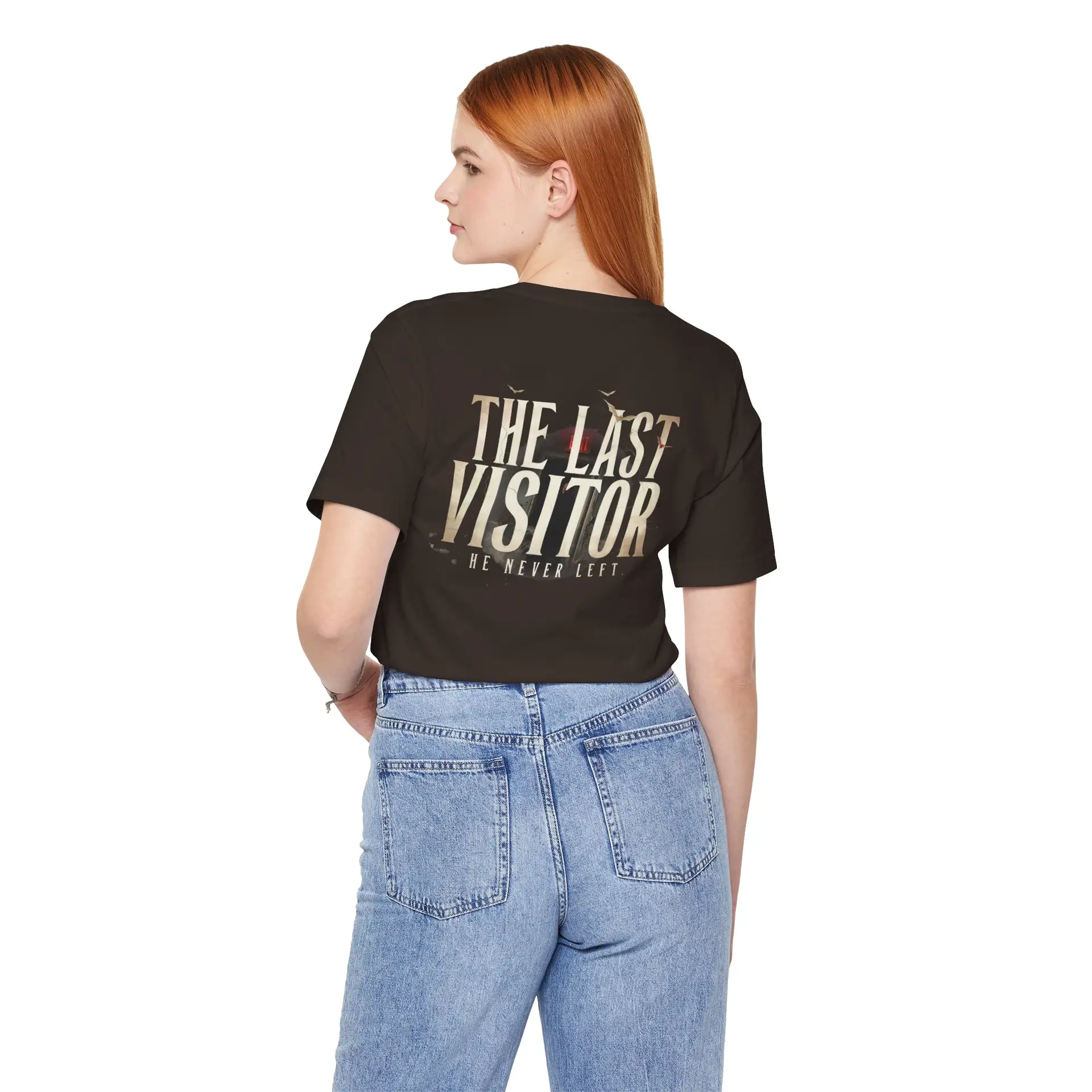 Image Alt Text (Front) Black Bella+Canvas 3001 unisex t-shirt featuring a vintage gothic "Visitor" front graphic with minimalist horror typography, modeled in a studio setting. Image Alt Text (Back) Back view of a black Bella+Canvas 3001 unisex t-shirt featuring "The Last Visitor" gothic horror back graphic with vintage typography and subtle distressed details, modeled in a studio setting.