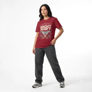 Woman wearing a red Night Shift vintage moth graphic unisex t-shirt with gothic typography and pocket watch illustration on a white studio background.