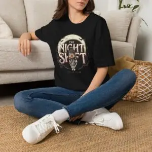 Model wearing The Night Shift vintage lantern moon graphic unisex T-shirt Short Product Text Made for the hours after dark. The Night Shift T-Shirt pairs a vintage lantern moon graphic with a slightly distressed finish for an understated nighttime streetwear look. SEO Keywords / Tags the night shift t-shirt, night shift graphic tee, vintage lantern t-shirt, moon graphic tee, after dark t-shirt, night owl shirt, vintage streetwear, distressed graphic tee, nighttime t-shirt, unisex graphic tee, retro graphic t-shirt