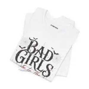 Front Mockup 1 Woman wearing the Bad Girls Go to the Haunted House Halloween graphic t-shirt featuring vintage typography, pumpkins, bats, and spiderweb artwork. Front Mockup 2 Cute Halloween graphic tee with "Bad Girls Go to the Haunted House" design on a premium Bella+Canvas 3001 t-shirt. Front Mockup 3 Women's spooky season t-shirt featuring vintage pumpkin artwork and playful Halloween typography. Front Mockup 4 Bella+Canvas Halloween t-shirt with gothic lettering, smiling jack-o'-lanterns, bats, and autumn floral details. Back Mockup 1 Back view of the Bella+Canvas 3001 Halloween graphic t-shirt showing the modern retail fit. Back Mockup 2 Rear view of the premium unisex Halloween t-shirt from Brumbynorth. Close-up 1 Close-up of the premium Halloween graphic print showing detailed typography, pumpkins, and bats. Close-up 2 Detailed close-up of the DTF printed Halloween artwork on soft Airlume combed ring-spun cotton