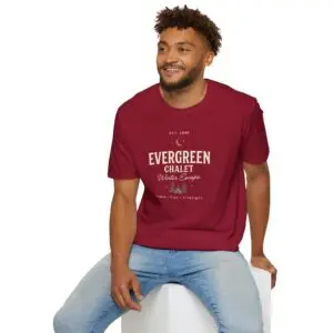 Evergreen Chalet Winter Escape Christmas graphic T-shirt on female model Forest green vintage Christmas cabin graphic tee front view Cozy winter lodge inspired unisex holiday T-shirt Evergreen Chalet Christmas shirt premium cotton graphic tee