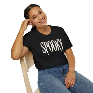 Model wearing a black unisex SPOOKY Halloween graphic T-shirt Short Product Text A bold “SPOOKY” graphic tee with a vintage gothic horror feel. Lightweight, unisex and easy to style for Halloween season or everyday streetwear.