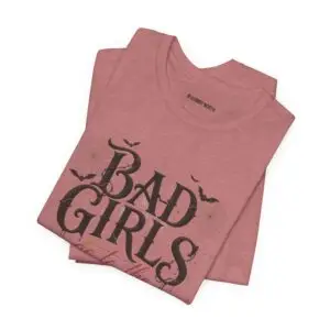 Front Mockup 1 Woman wearing the Bad Girls Go to the Haunted House Halloween graphic t-shirt featuring vintage typography, pumpkins, bats, and spiderweb artwork. Front Mockup 2 Cute Halloween graphic tee with "Bad Girls Go to the Haunted House" design on a premium Bella+Canvas 3001 t-shirt. Front Mockup 3 Women's spooky season t-shirt featuring vintage pumpkin artwork and playful Halloween typography. Front Mockup 4 Bella+Canvas Halloween t-shirt with gothic lettering, smiling jack-o'-lanterns, bats, and autumn floral details. Back Mockup 1 Back view of the Bella+Canvas 3001 Halloween graphic t-shirt showing the modern retail fit. Back Mockup 2 Rear view of the premium unisex Halloween t-shirt from Brumbynorth. Close-up 1 Close-up of the premium Halloween graphic print showing detailed typography, pumpkins, and bats. Close-up 2 Detailed close-up of the DTF printed Halloween artwork on soft Airlume combed ring-spun cotton
