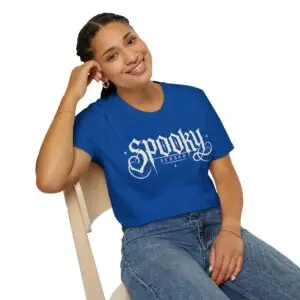 Model wearing a black Spooky Season gothic Halloween graphic unisex T-shirt Short Product Text Lean into Halloween season with a vintage gothic “spooky season” graphic tee. A lightweight unisex T-shirt made for autumn streetwear, horror nights and everyday casual looks.