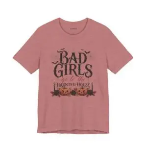 Front Mockup 1 Woman wearing the Bad Girls Go to the Haunted House Halloween graphic t-shirt featuring vintage typography, pumpkins, bats, and spiderweb artwork. Front Mockup 2 Cute Halloween graphic tee with "Bad Girls Go to the Haunted House" design on a premium Bella+Canvas 3001 t-shirt. Front Mockup 3 Women's spooky season t-shirt featuring vintage pumpkin artwork and playful Halloween typography. Front Mockup 4 Bella+Canvas Halloween t-shirt with gothic lettering, smiling jack-o'-lanterns, bats, and autumn floral details. Back Mockup 1 Back view of the Bella+Canvas 3001 Halloween graphic t-shirt showing the modern retail fit. Back Mockup 2 Rear view of the premium unisex Halloween t-shirt from Brumbynorth. Close-up 1 Close-up of the premium Halloween graphic print showing detailed typography, pumpkins, and bats. Close-up 2 Detailed close-up of the DTF printed Halloween artwork on soft Airlume combed ring-spun cotton