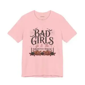 Front Mockup 1 Woman wearing the Bad Girls Go to the Haunted House Halloween graphic t-shirt featuring vintage typography, pumpkins, bats, and spiderweb artwork. Front Mockup 2 Cute Halloween graphic tee with "Bad Girls Go to the Haunted House" design on a premium Bella+Canvas 3001 t-shirt. Front Mockup 3 Women's spooky season t-shirt featuring vintage pumpkin artwork and playful Halloween typography. Front Mockup 4 Bella+Canvas Halloween t-shirt with gothic lettering, smiling jack-o'-lanterns, bats, and autumn floral details. Back Mockup 1 Back view of the Bella+Canvas 3001 Halloween graphic t-shirt showing the modern retail fit. Back Mockup 2 Rear view of the premium unisex Halloween t-shirt from Brumbynorth. Close-up 1 Close-up of the premium Halloween graphic print showing detailed typography, pumpkins, and bats. Close-up 2 Detailed close-up of the DTF printed Halloween artwork on soft Airlume combed ring-spun cotton