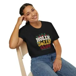 Holly Jolly Club retro Christmas graphic T-shirt on female model Black Holly Jolly Club holiday graphic tee front view Vintage Christmas typography unisex T-shirt Retro festive Christmas shirt with holly leaf design