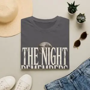 Front Mockup 1 The Night Remembers gothic moon graphic t-shirt featuring vintage typography, full moon, bats and haunted tree artwork. Front Mockup 2 Women's gothic Halloween graphic tee with The Night Remembers vintage moon design. Front Mockup 3 Vintage Halloween t-shirt with bold gothic typography and spooky moon artwork. Front Mockup 4 Dark aesthetic graphic t-shirt featuring The Night Remembers moon and haunted forest illustration. Back Mockup 1 Back view of The Night Remembers gothic Halloween t-shirt showing premium unisex fit. Back Mockup 2 Rear view of premium Gildan 64000 Halloween graphic tee from Brumbynorth. Close-up 1 Close-up of premium DTG printed gothic moon artwork on soft ring-spun cotton fabric. Close-up 2 Detailed close-up of The Night Remembers Halloween graphic showing crisp vintage typography and moon illustration.