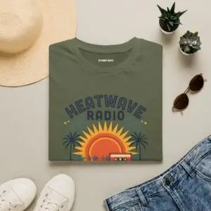 A vintage summer broadcast in T-shirt form. Heatwave Radio combines sunset colors, palm trees and retro radio graphics for an easygoing streetwear look.