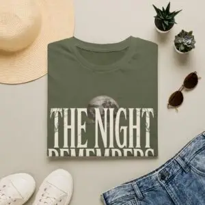 Front Mockup 1 The Night Remembers gothic moon graphic t-shirt featuring vintage typography, full moon, bats and haunted tree artwork. Front Mockup 2 Women's gothic Halloween graphic tee with The Night Remembers vintage moon design. Front Mockup 3 Vintage Halloween t-shirt with bold gothic typography and spooky moon artwork. Front Mockup 4 Dark aesthetic graphic t-shirt featuring The Night Remembers moon and haunted forest illustration. Back Mockup 1 Back view of The Night Remembers gothic Halloween t-shirt showing premium unisex fit. Back Mockup 2 Rear view of premium Gildan 64000 Halloween graphic tee from Brumbynorth. Close-up 1 Close-up of premium DTG printed gothic moon artwork on soft ring-spun cotton fabric. Close-up 2 Detailed close-up of The Night Remembers Halloween graphic showing crisp vintage typography and moon illustration.
