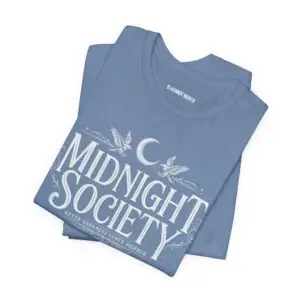Midnight Society Gothic Halloween graphic t-shirt featuring vintage moon and bat front design. Bella+Canvas Midnight Society Halloween t-shirt with gothic front print on premium unisex cotton tee. Front view of Midnight Society spooky season graphic tee with moon, bats and vintage gothic typography. Premium Halloween graphic t-shirt with minimalist Midnight Society front artwork for autumn fashion. Back Images (2) Back view of Midnight Society Halloween t-shirt featuring large moonlit cemetery, gothic church and vintage horror artwork. Oversized gothic Halloween back graphic with cathedral, moon, ravens and vintage cemetery illustration on Bella+Canvas tee. Close-Up Images (2) Close-up of premium DTF printed Midnight Society graphic showing detailed gothic artwork and sharp vintage typography. Detailed close-up of moonlit cemetery Halloween print with distressed gothic illustration on soft Bella+Canvas cotton t-shirt