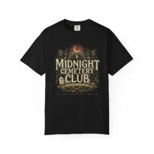 Front View Woman wearing a Comfort Colors Midnight Cemetery Club Halloween graphic t-shirt featuring vintage gothic typography, moonlit cemetery artwork, and a relaxed garment-dyed fit. Lifestyle Alt Text Premium Comfort Colors 1717 garment-dyed Halloween t-shirt with Midnight Cemetery Club vintage cemetery design, photographed on a female model in a casual lifestyle setting.