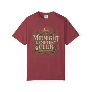 Front View Woman wearing a Comfort Colors Midnight Cemetery Club Halloween graphic t-shirt featuring vintage gothic typography, moonlit cemetery artwork, and a relaxed garment-dyed fit. Lifestyle Alt Text Premium Comfort Colors 1717 garment-dyed Halloween t-shirt with Midnight Cemetery Club vintage cemetery design, photographed on a female model in a casual lifestyle setting.