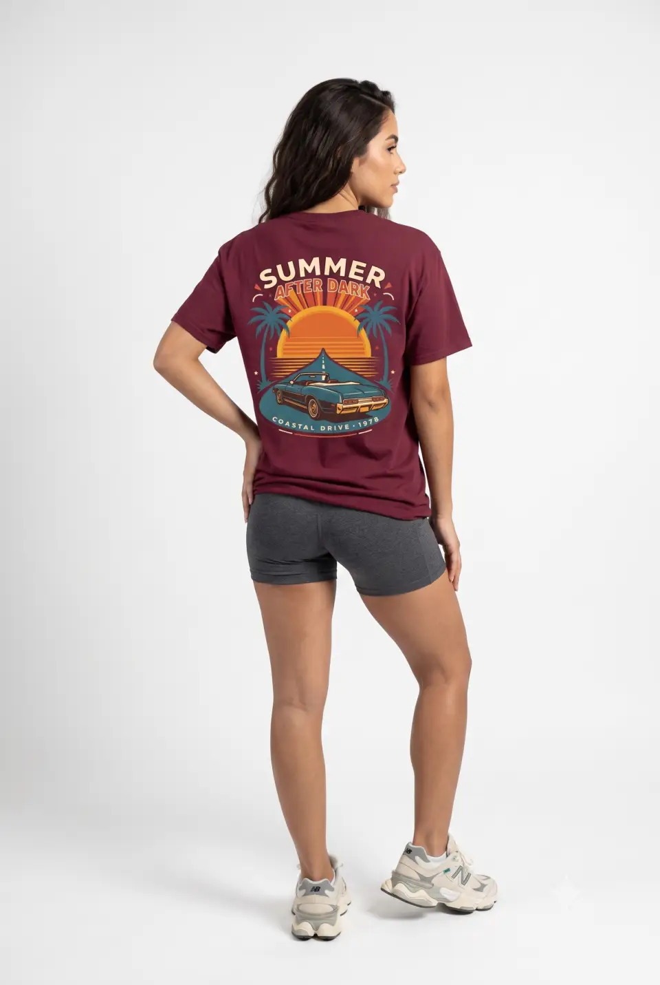 A retro summer road-trip graphic featuring a sunset, palm trees and classic car details, finished with Summer After Dark and Coastal Drive — 1979 lettering. A bold vintage-inspired addition to everyday streetwear.